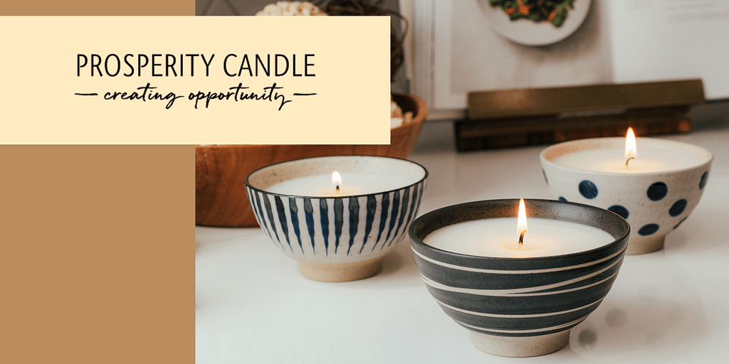 Image: The Prosperity Candle Logo next to three of their candles.