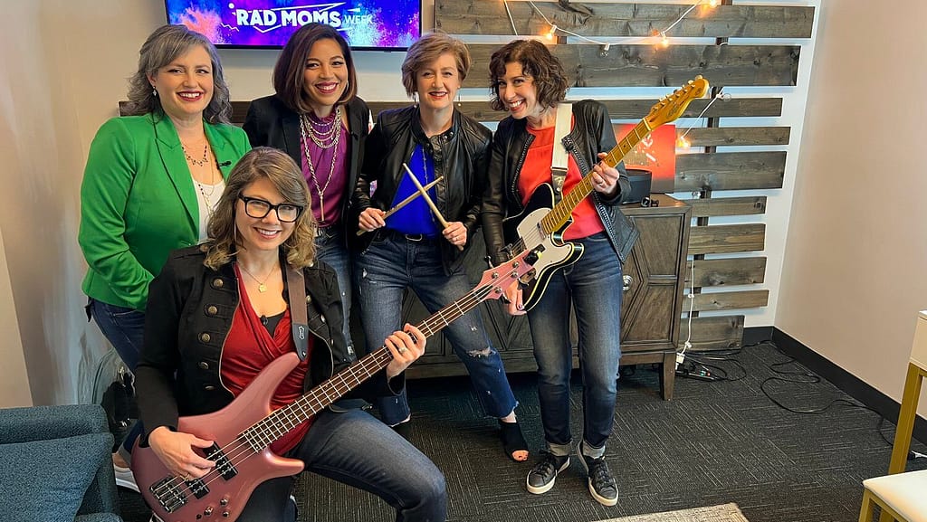 Band members of the Lazy Susan hang out backstage.