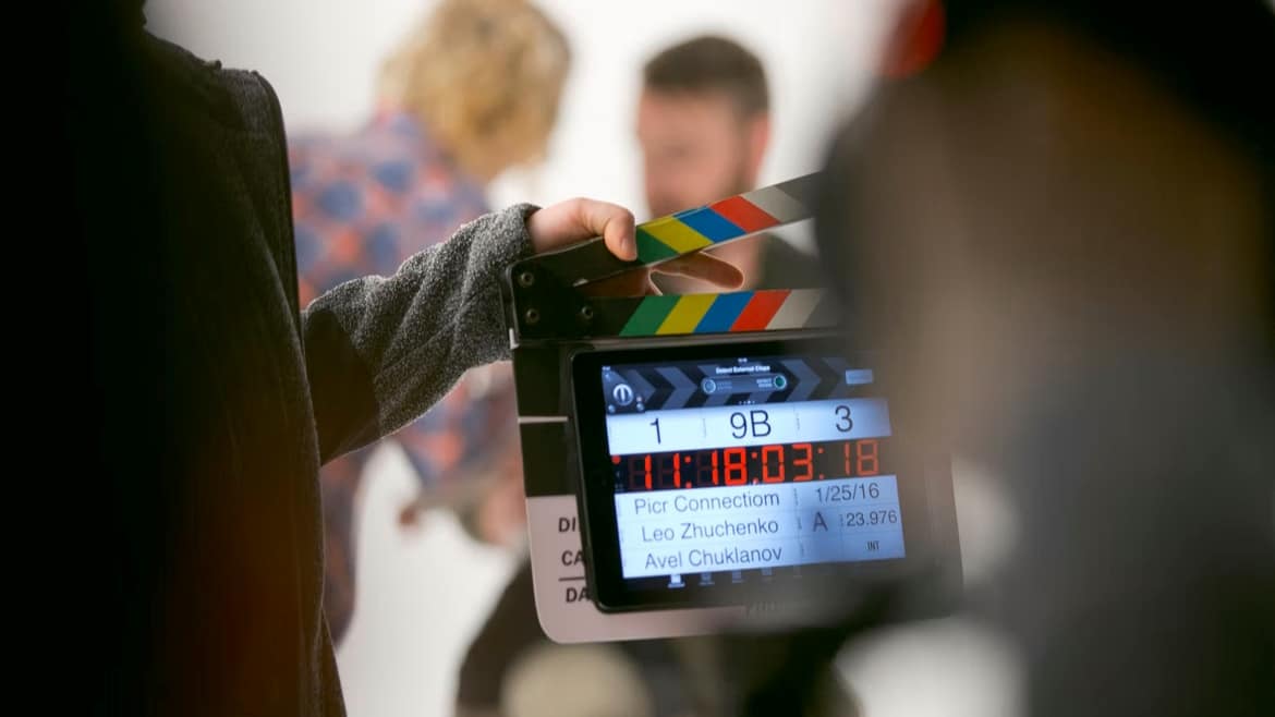 Image: A film assistant holding a clapperback.