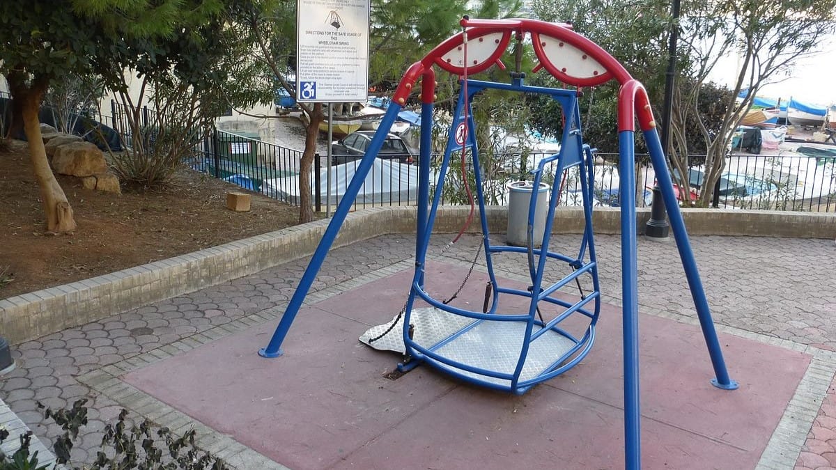 Image: A wheelchair accessible swing in a park in Malta.