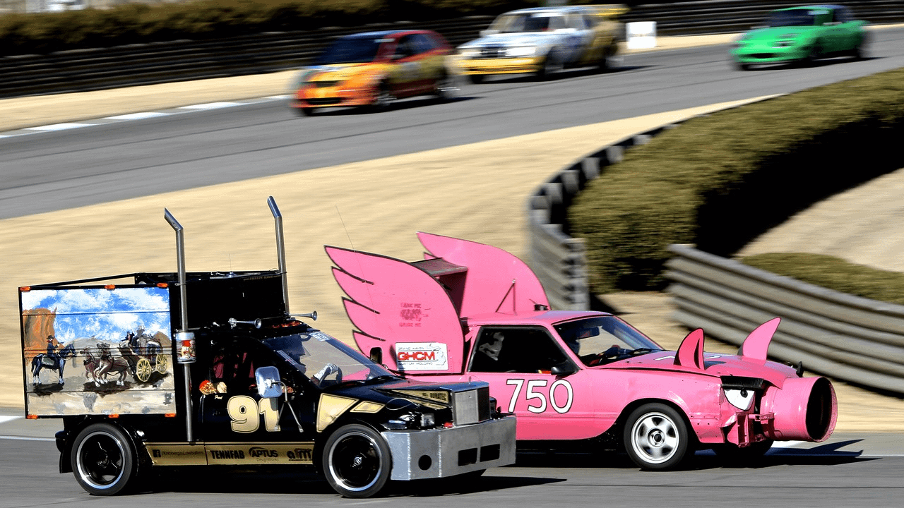 Image: two cars racing in the 24-hours of lemons