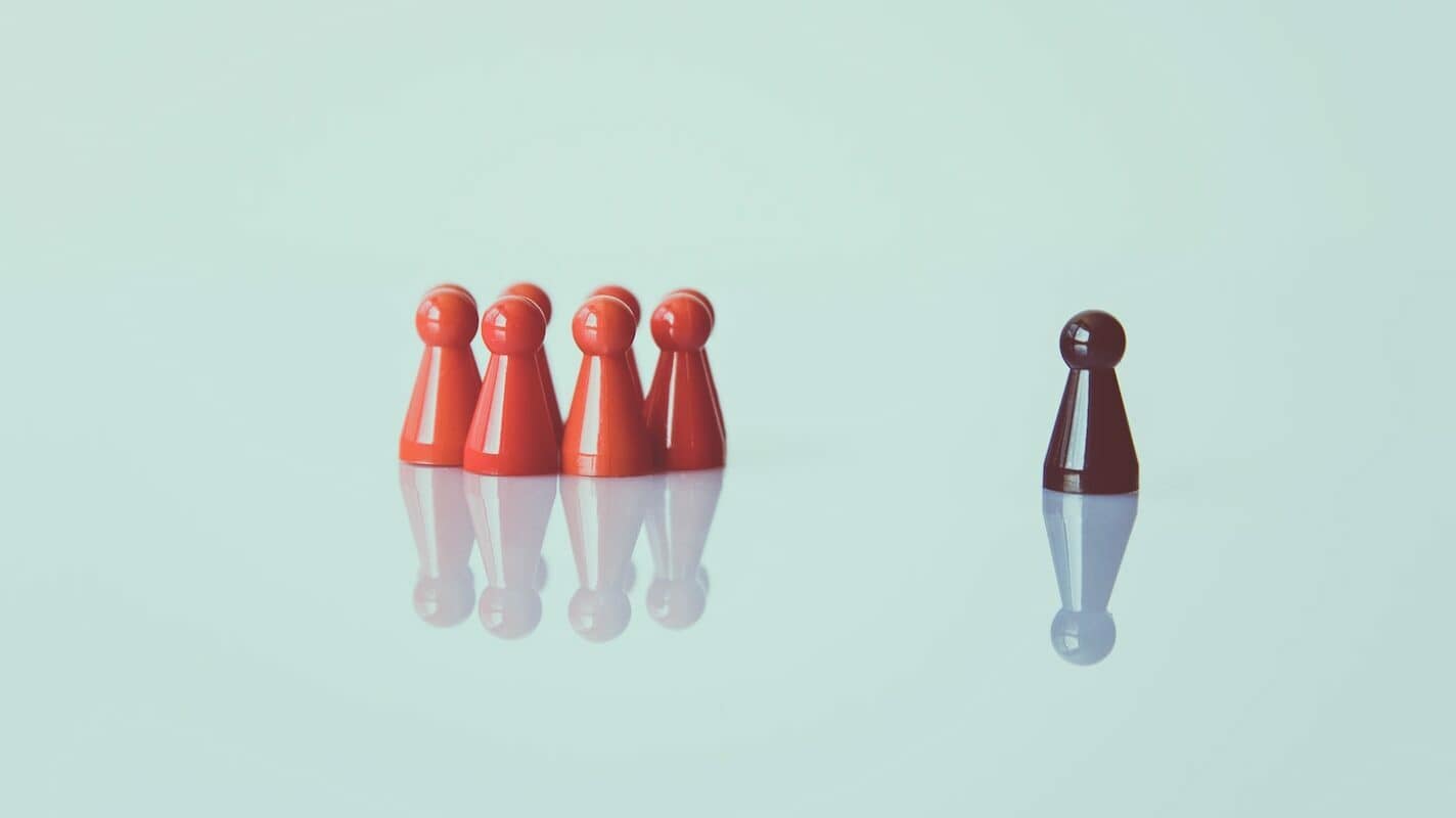 brown game pieces on white surface