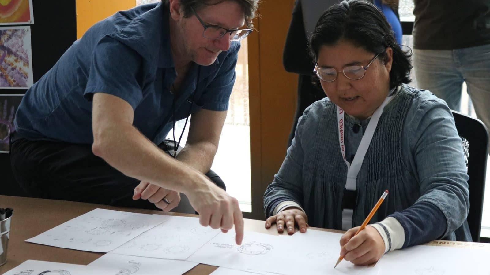 Image: Special Olympics Athlete Sketching in the United O logo collaboration