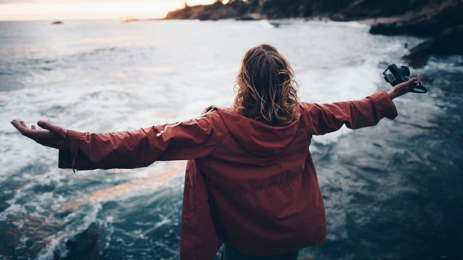 person standing near body of water