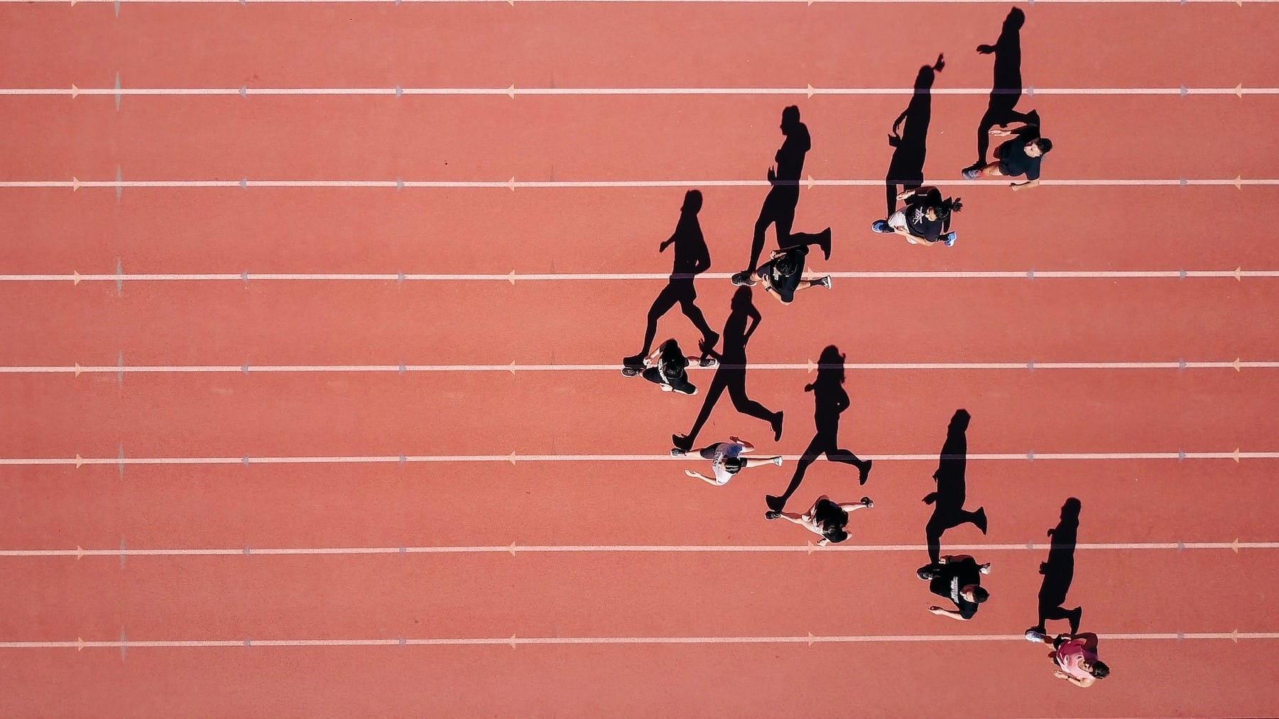 Image: Runners on a track, everyone starting at a different place.