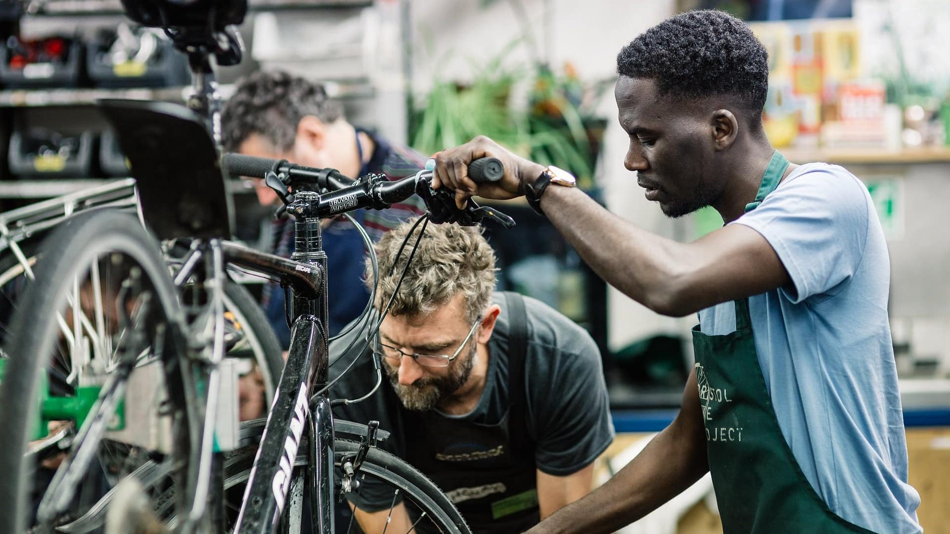 Image: Bristol Bike Project Members working on a bike together