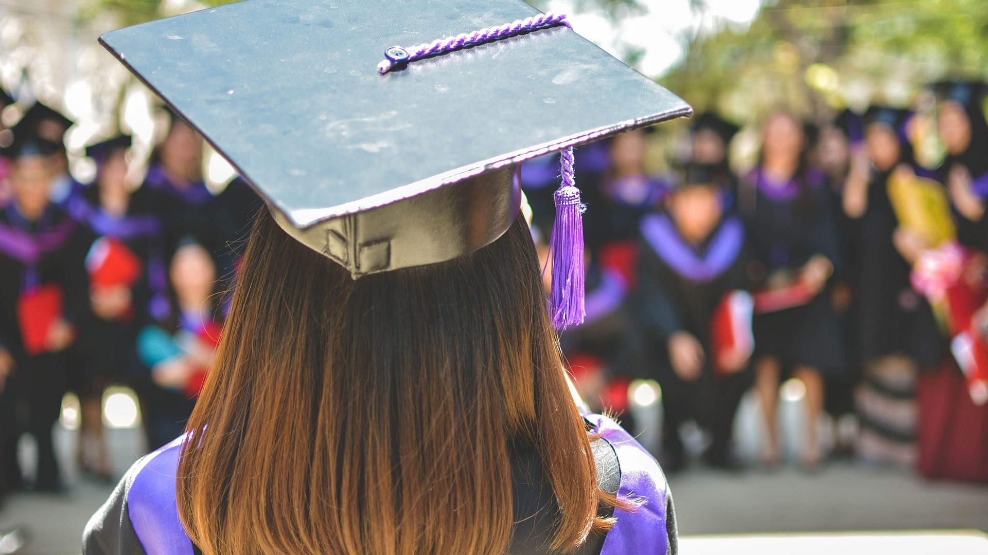 Image: A valedictorian at commencement, facing the crowd of graduates the way this non-speaking valedictorian did in her speech.