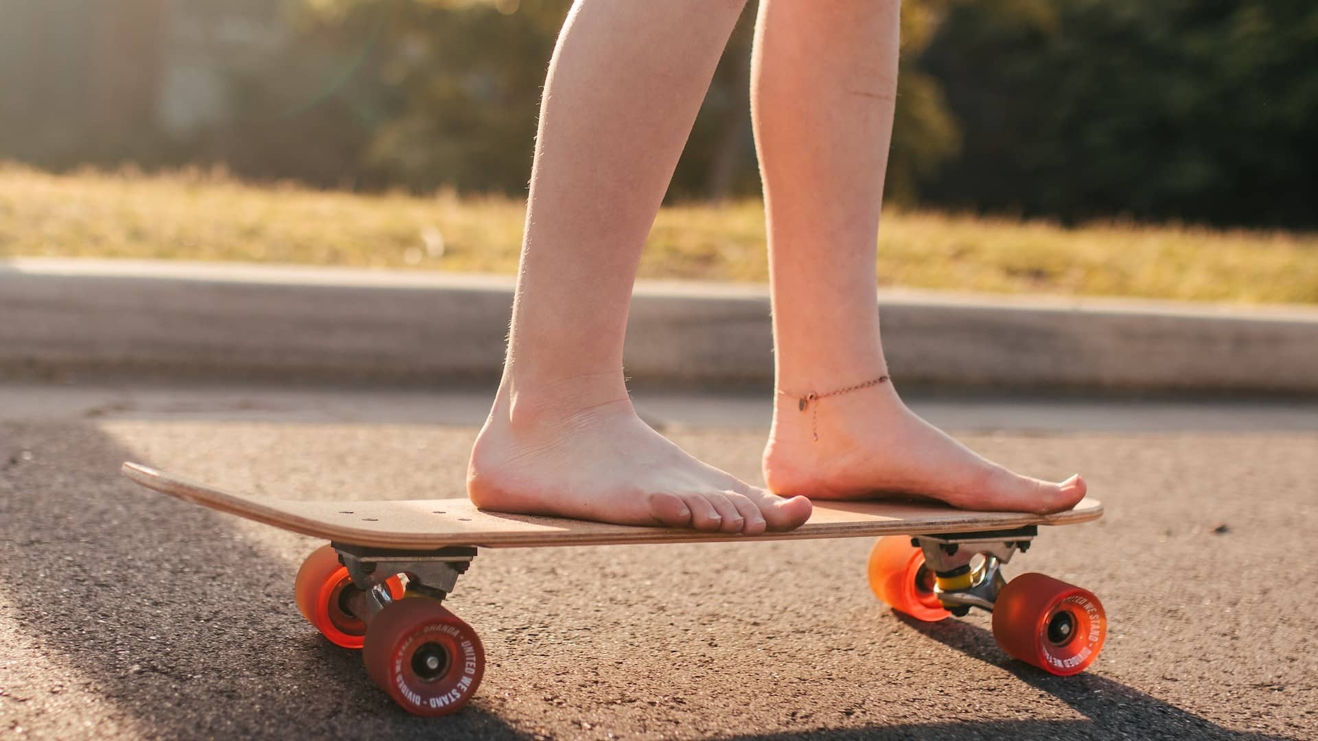 Image: A person skateboarding barefoot