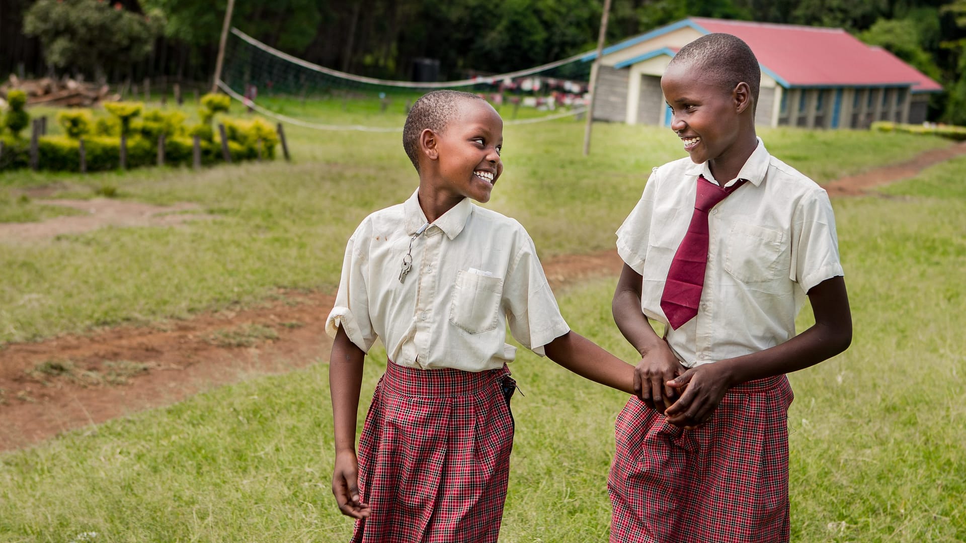 Image: Two smiling students from Kakenyas Center for Excellence!