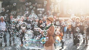 Image: a woman sanding in a cloud of bubbles
