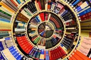 Image: Shelves of library books manipulated into concentric circles