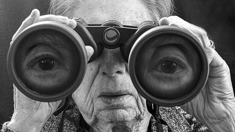 Image: Grandmother looking through binoculars