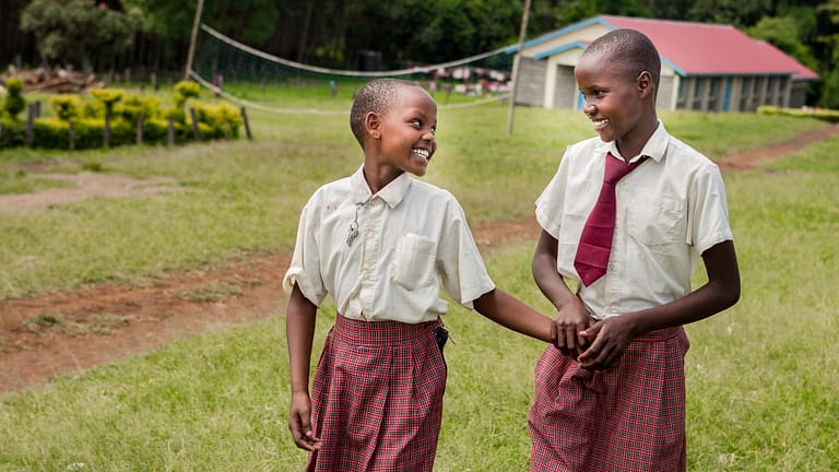 Image: Two smiling students from Kakenyas Center for Excellence!