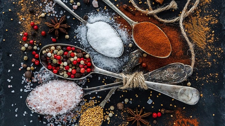 Image: An array of colorful spices on spoons
