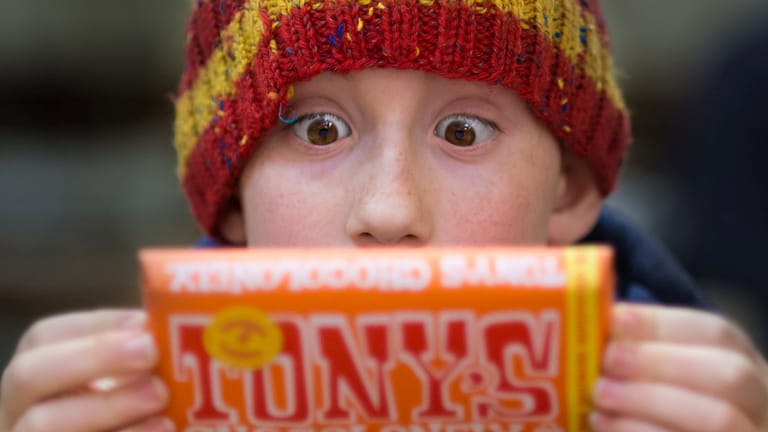 Image: A boy staring wide-eyed at a candy bar