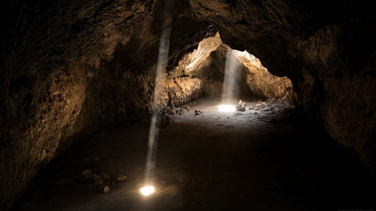 Image: Light shining into a dark cave.