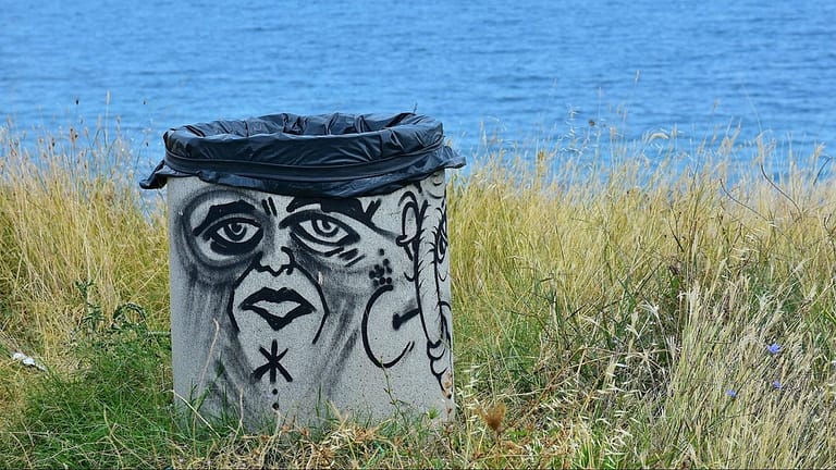 Image: Graffiti face on a garbage can