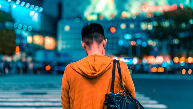 Image: Japan's "Do-Nothing Guy" walking through Tokyo