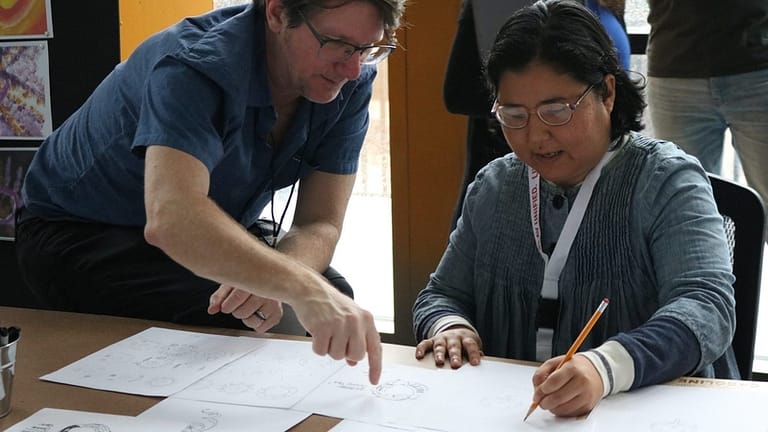 Image: Special Olympics Athlete Sketching in the United O logo collaboration