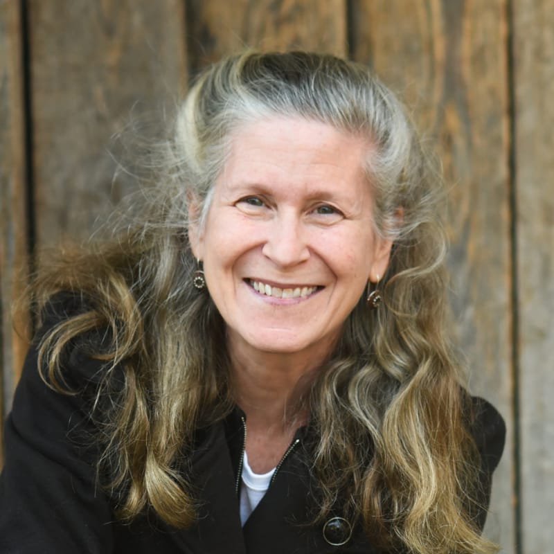 Author and innovator Zoe Weil smiles at the camera.