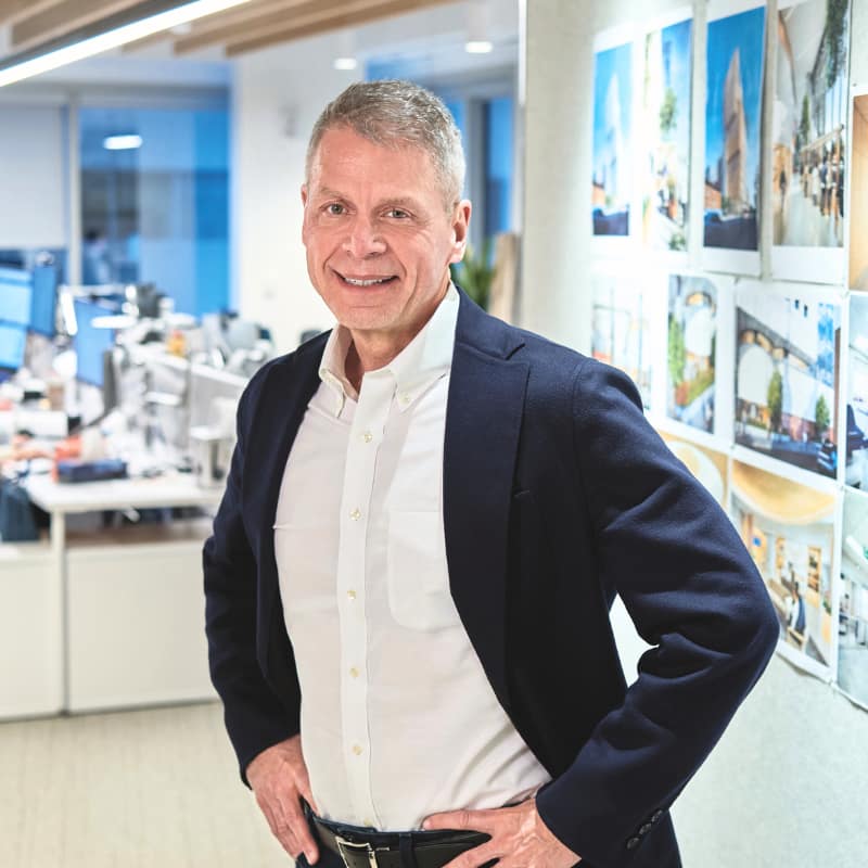 architect craig applegath stands in his studio