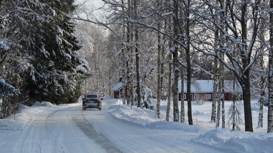 Image: A car driving on an icy stretch where sugar beets have been used to de-ice roads.
