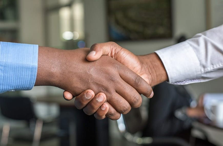 two people shaking hands