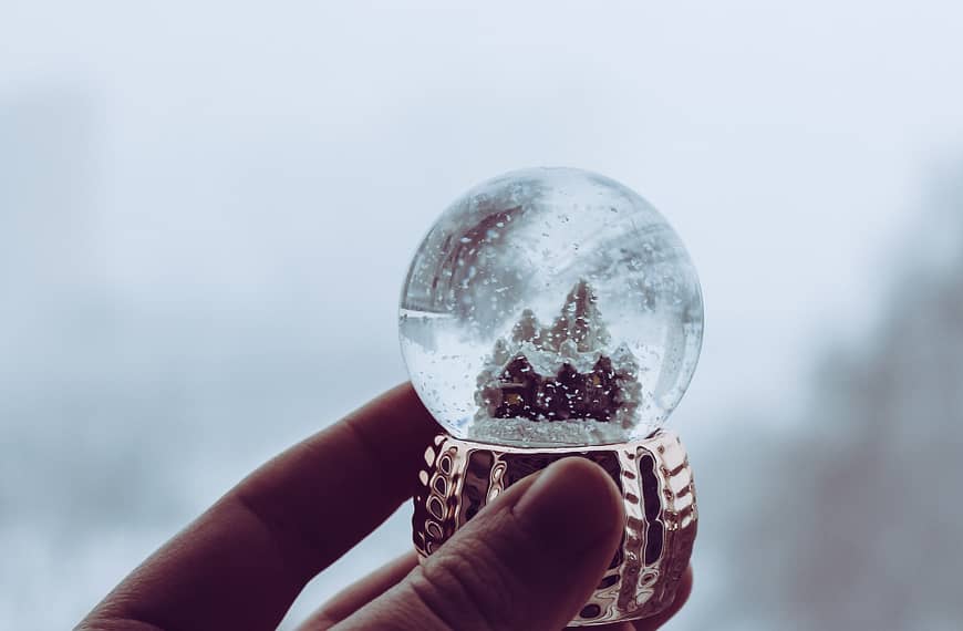 Image: A person holding a snow globe