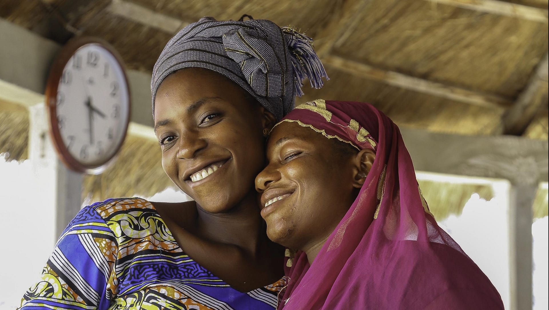 Image: Two women smiling and embracing