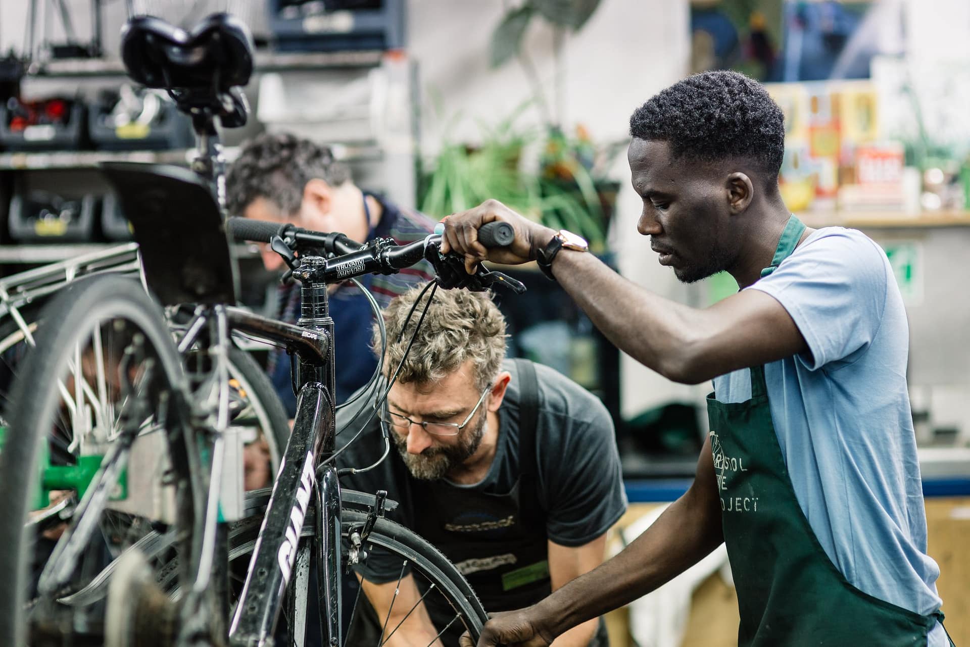Image: Bristol Bike Project Members working on a bike together