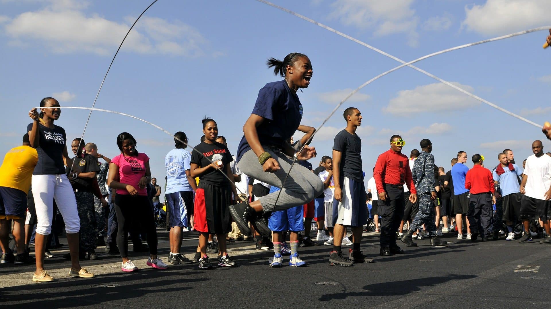 Image: girl jumping rope double dutch style