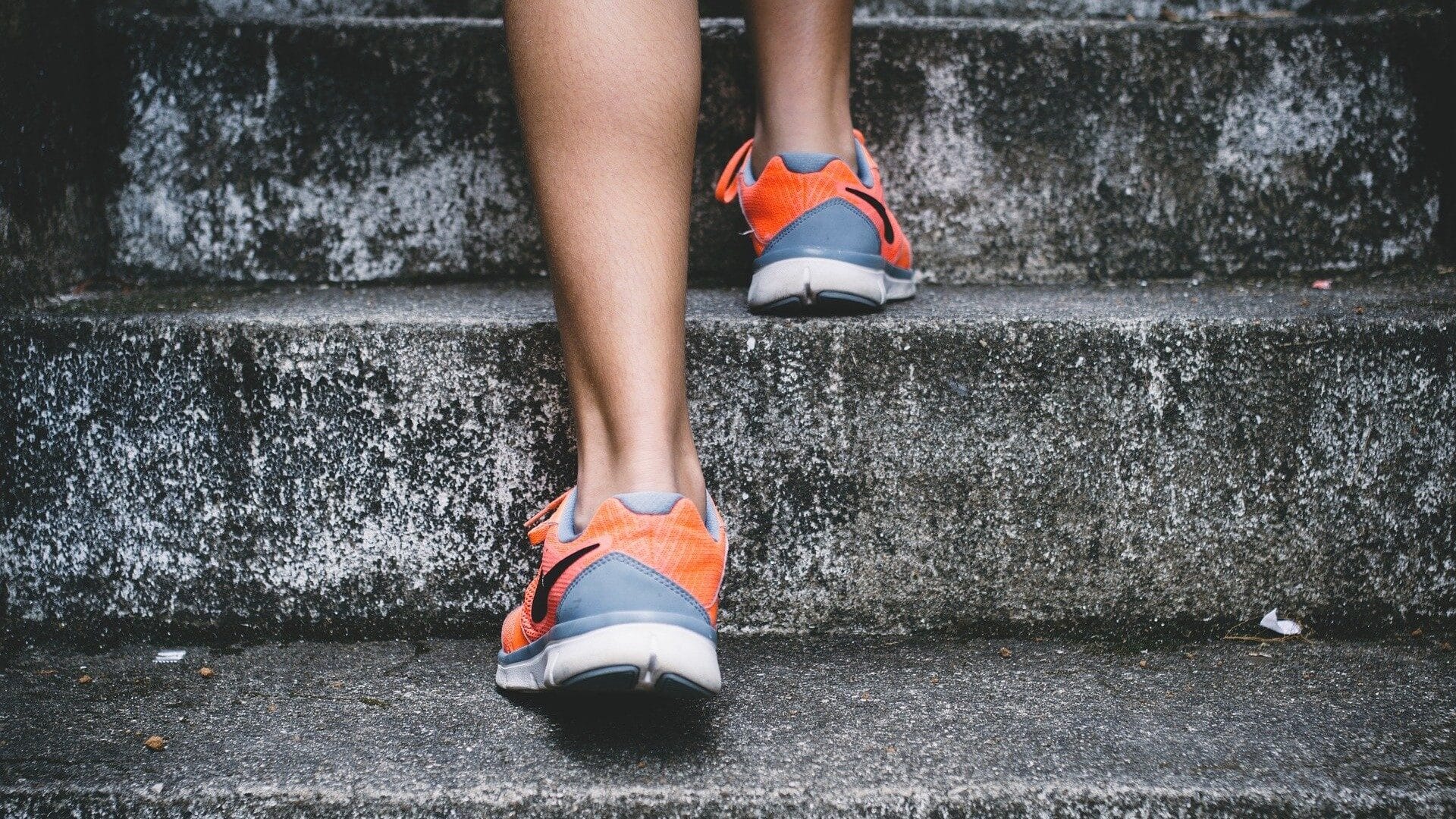 Image: Person walking up the steps of a stairway