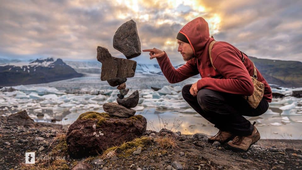 Image: Michael Grab beside one of his gravity-defying rock structures.