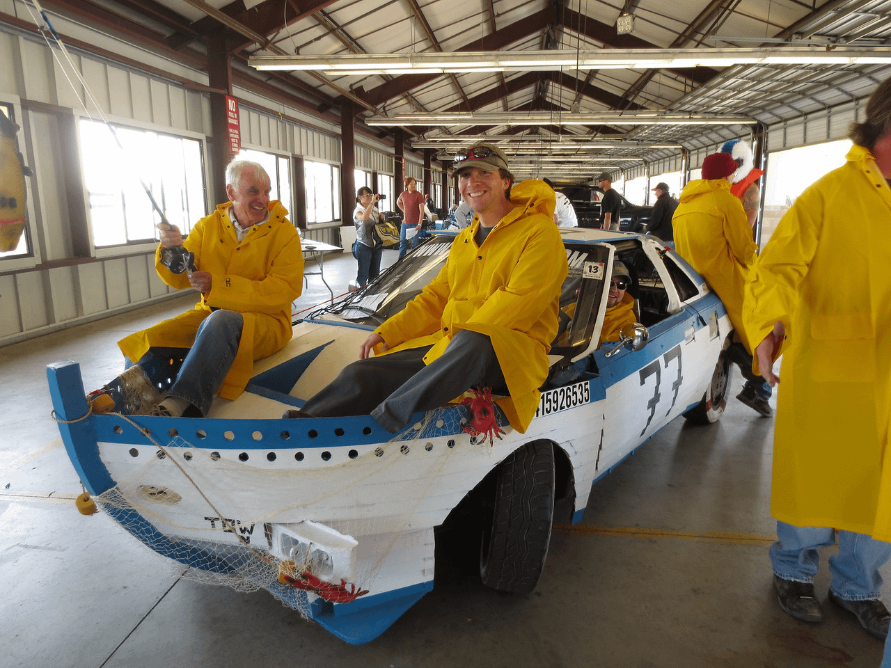 Image: Racers inside of their custom boat car 