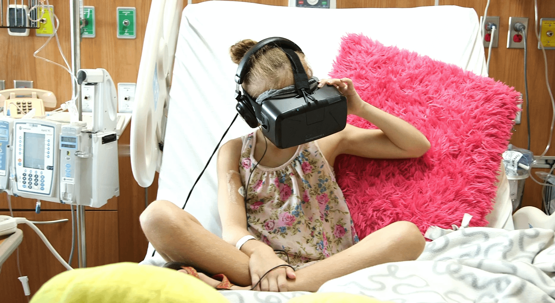 Image: young girl in a hospital bed wearing a virtual reality headset