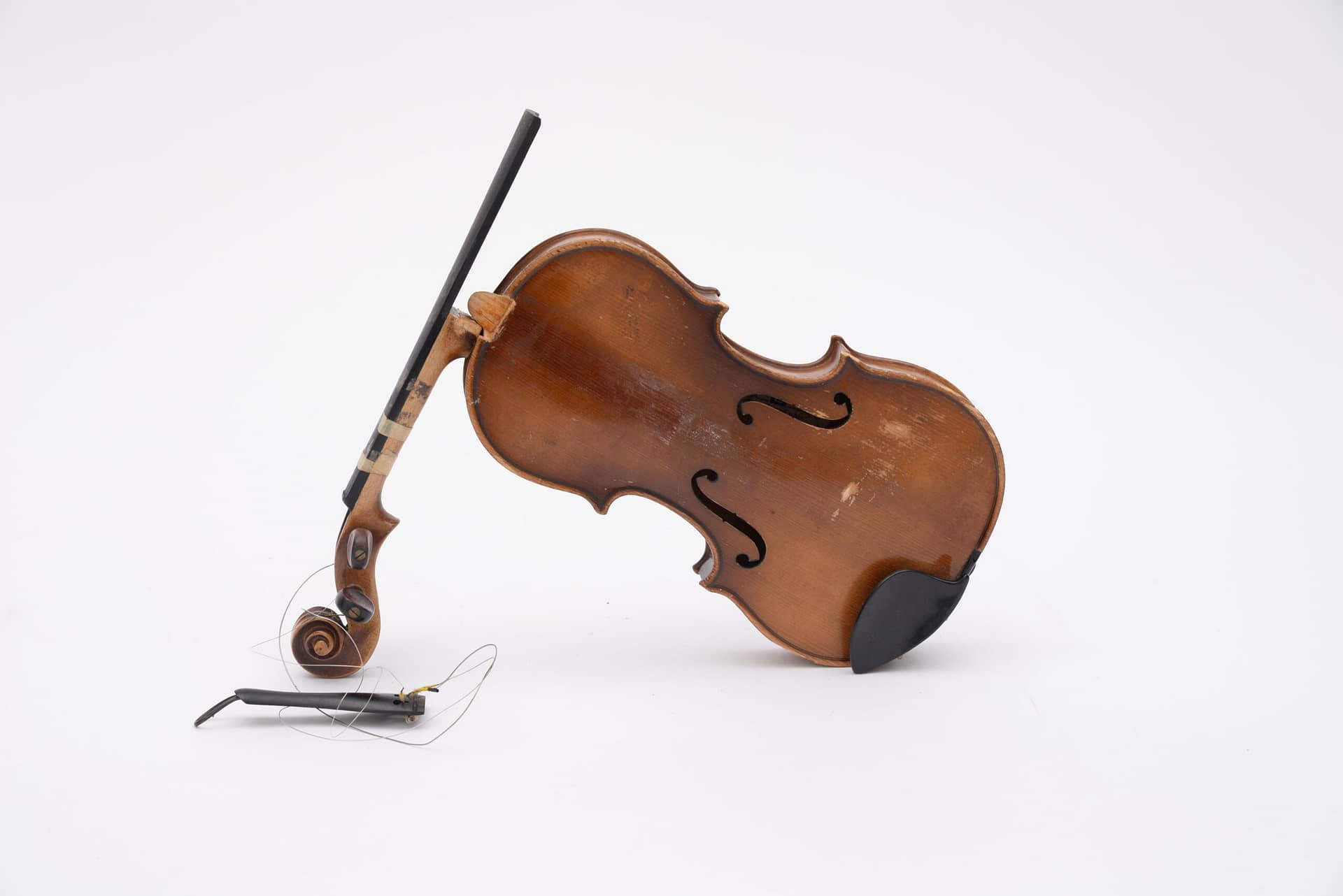 Image: A broken violin, one of the many broken instruments in this Philadelphia symphony.