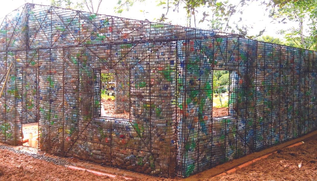 Image: Great people have filled metal cages with plastic bottles to create the framework of the houses. 