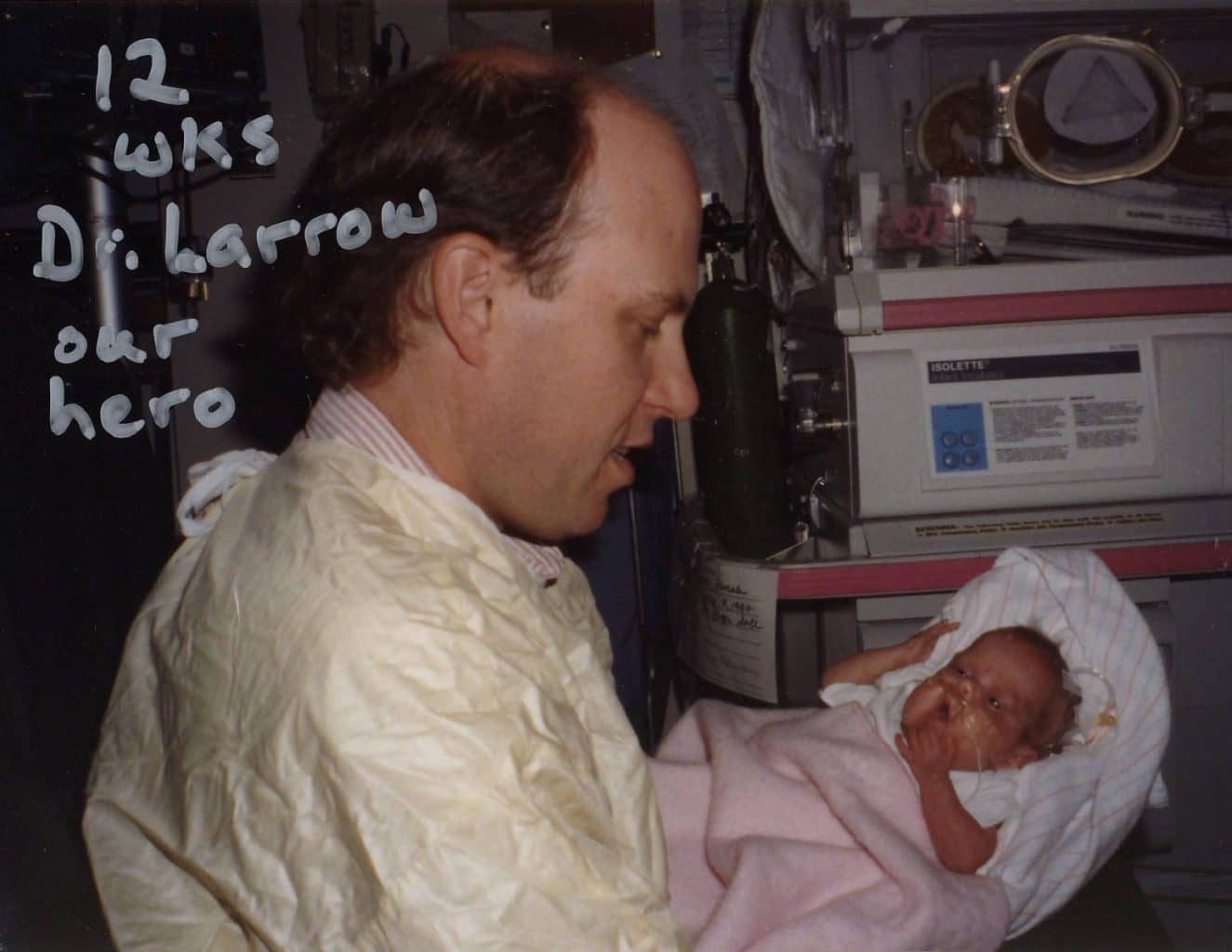 Image: Louisa being held by Dr. Larrow