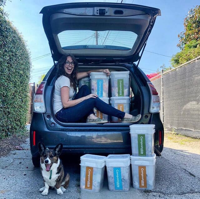 Image: person in the car with a bunch of the Compostable LA buckets! 