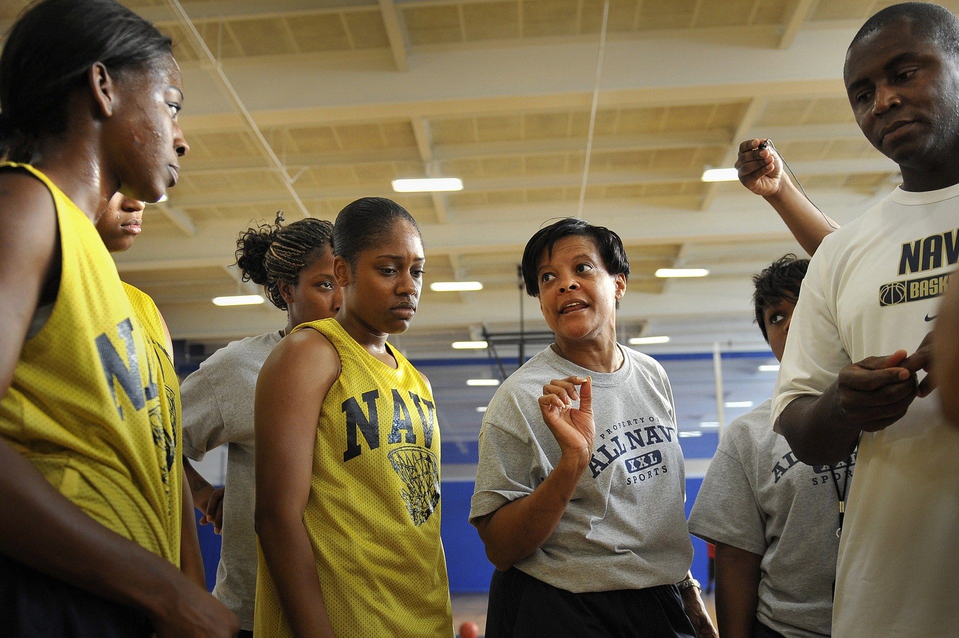 Image: Female coach coaching her team