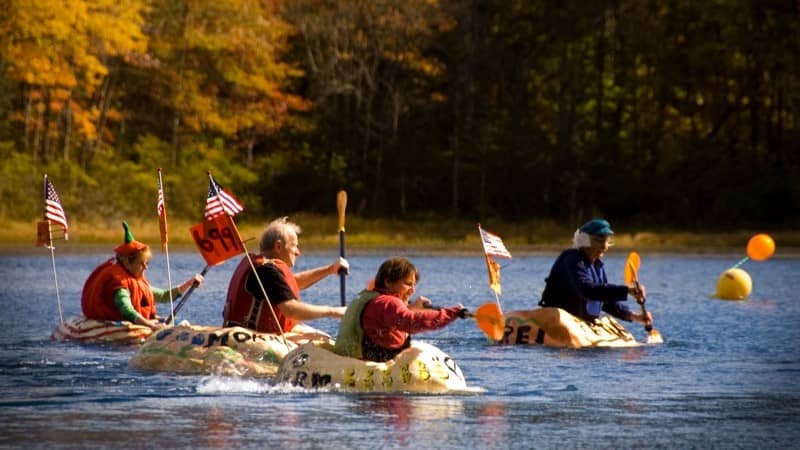 Image: people in giant pumpkins floating in the water! 