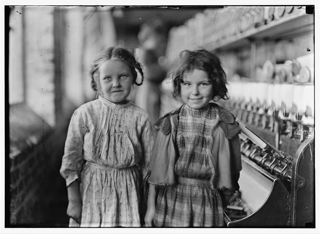Image: Photo taken by Lewis Hine of two young girls working at the cotton mill. 