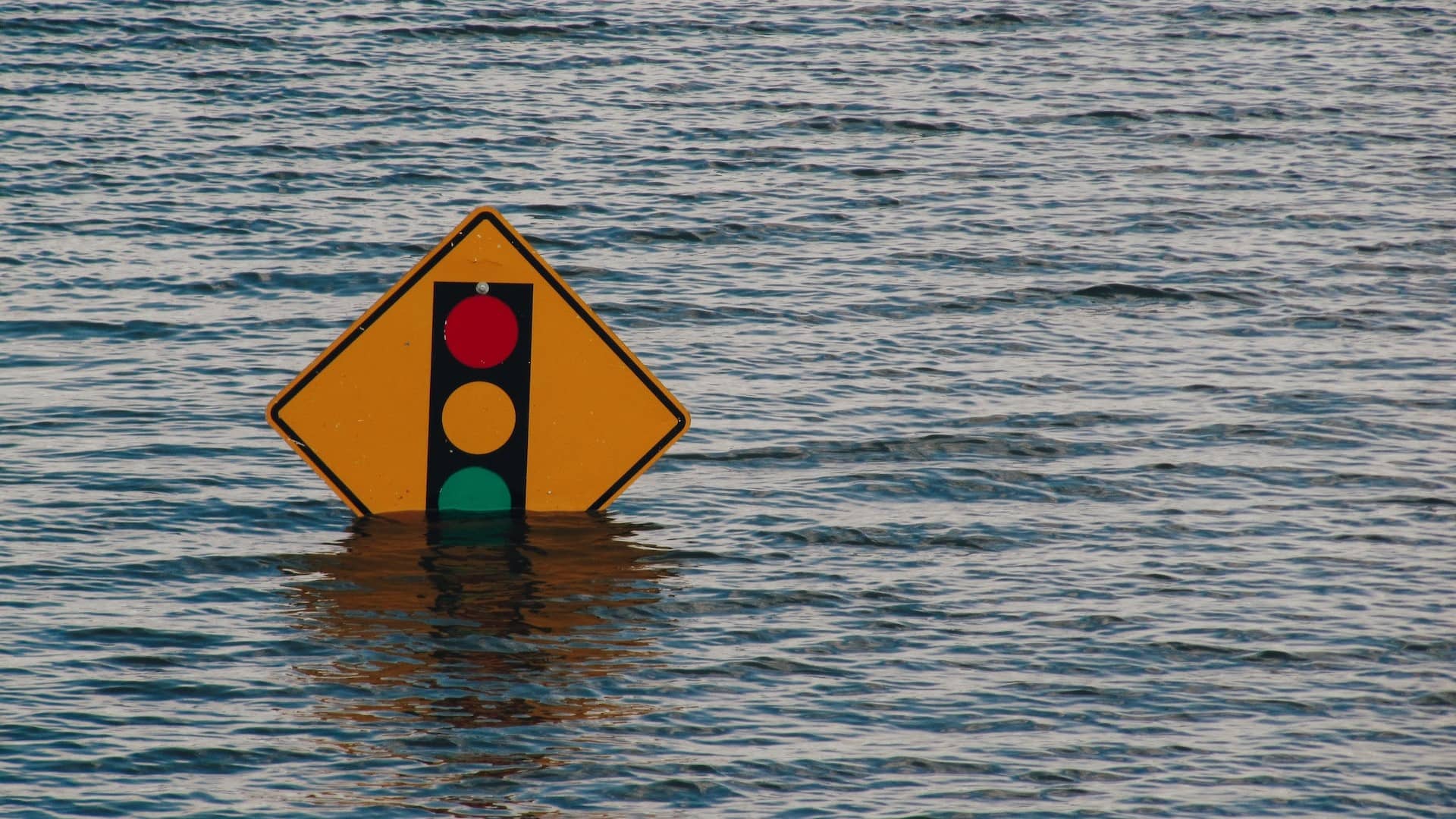 Image: A stop sign half submerged in water. Is it a good thing, or a bad thing?