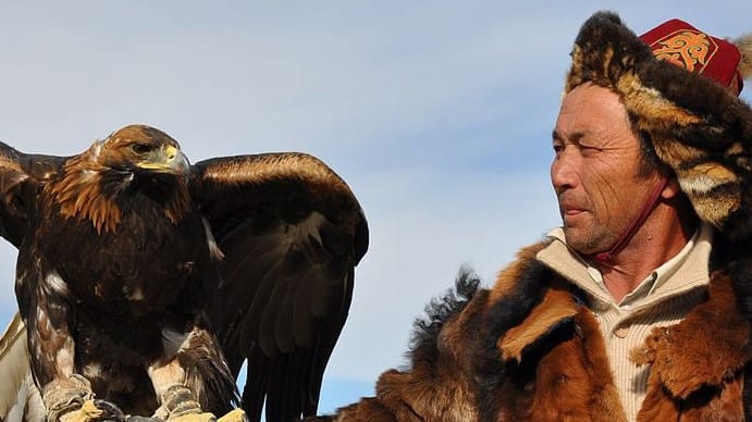 Image: Kazakh eagle hunter holding their eagle pal
