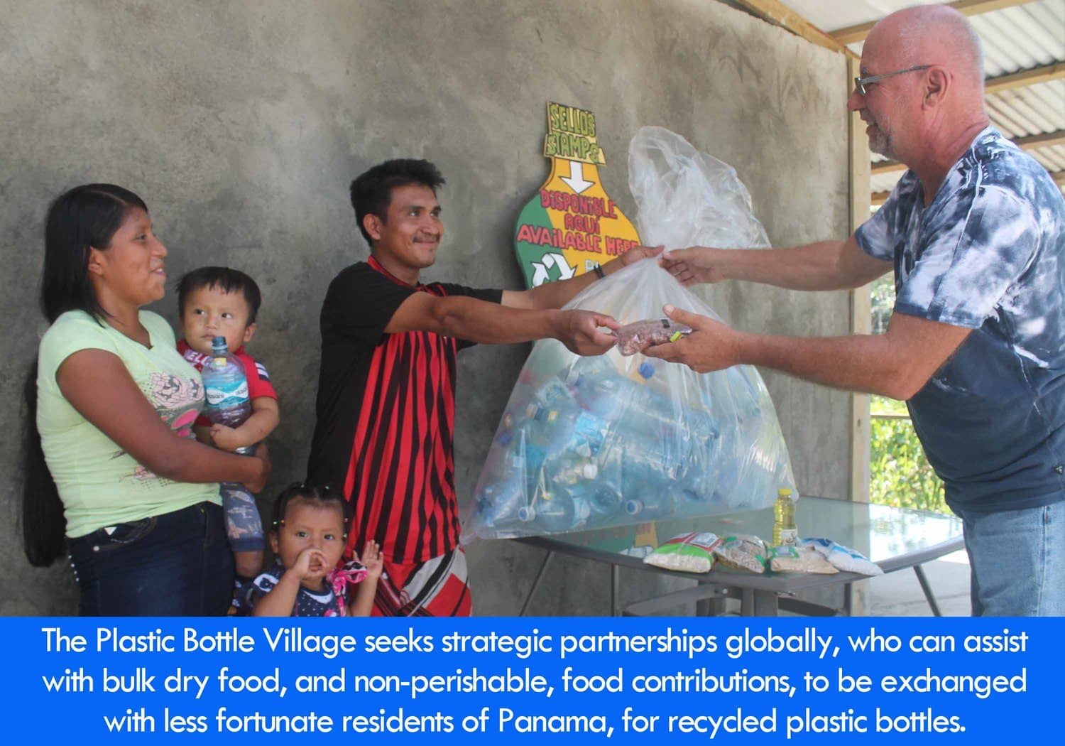 Image: Robert Bezeau is pictured exchanging bulk food with a man, for a bag of plastic bottles. The incentive is to make the area all around healthier.