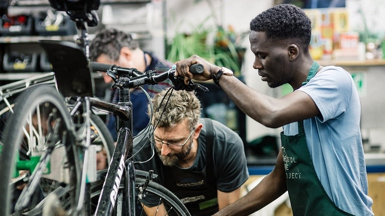 Image: Bristol Bike Project Members working on a bike together