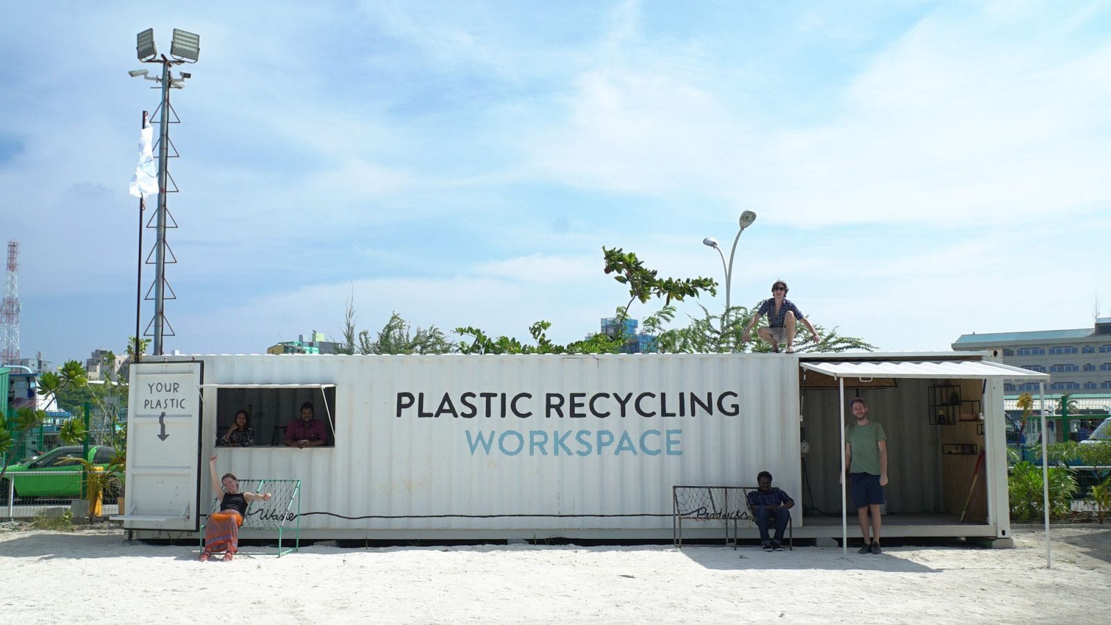 Image: Precious Plastics team members with the plastic recycling workspace in the Maldives