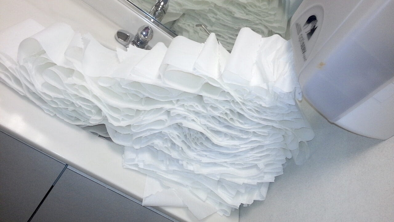 Image: Paper towel dispenser overflowing