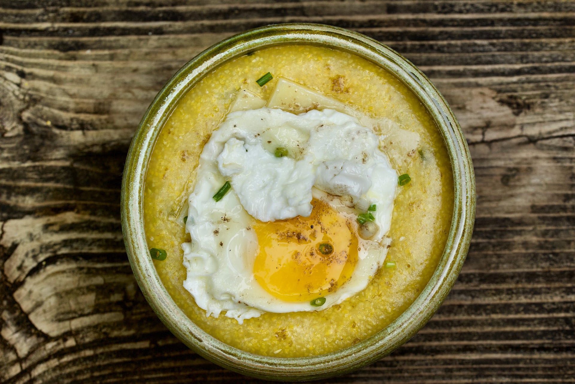 Image: Photo of grits in a bowl with an egg on top!