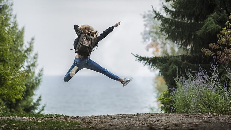 Image: Person jumping on a hiking trail